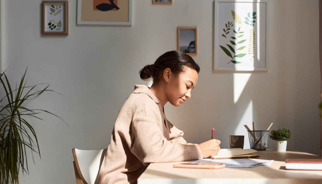 Girl Writing in Gratitude Journal